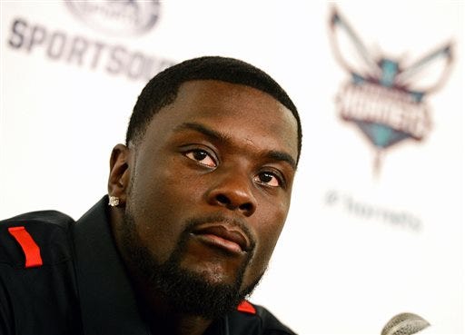 (Associated Press photo) Lance Stephenson during his July 21, 2014 news conference after signing a free agent contract with the Charlotte Hornets.