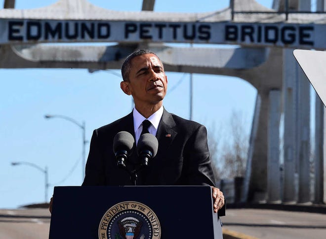 President Barack Obama speaks near the Edmund Pettus Bridge, Saturday, March 7, 2015, in Selma, Ala. This weekend marks the 50th anniversary of "Bloody Sunday," a civil rights march in which protestors were beaten, trampled and tear-gassed by police at the Edmund Pettus Bridge, in Selma. (AP Photo/Bill Frakes)