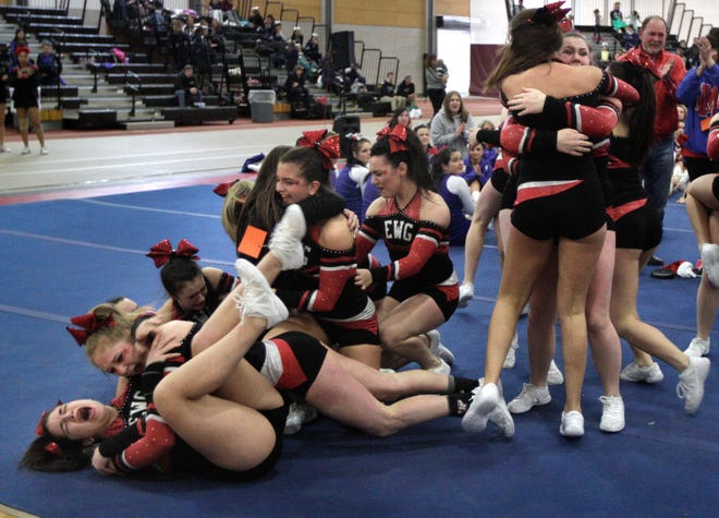 Members of the Exeter/West Greenwich cheerleading team celebrate as they win first place in the small team division of Sunday's Winter State Championships at the Providence Career and Technical Academy.