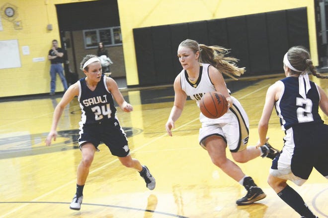 Abbey of St. Ignace drives between Sault High's Bree Swan and Brenna James during a game this season. Ostman was named the Straits Area Conference Player of the Year. Swan is also an all-conference first team pick and James was a second team all-conference choice.