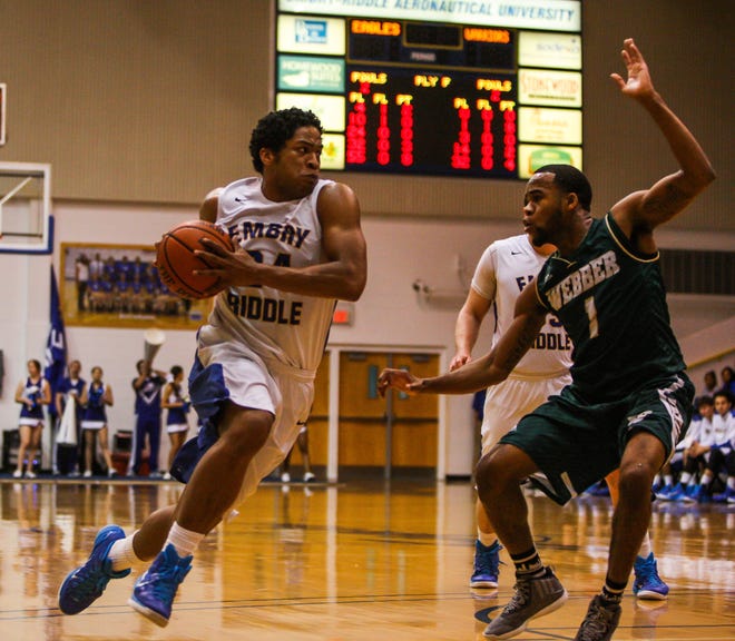 ERAU’s DeForest Carter, left, is half Seminole Indian and grew up on the Big Cypress Indian Reservation. Now he leads the Embry-Riddle basketball team into the NAIA Division II Men’s National Tournament.