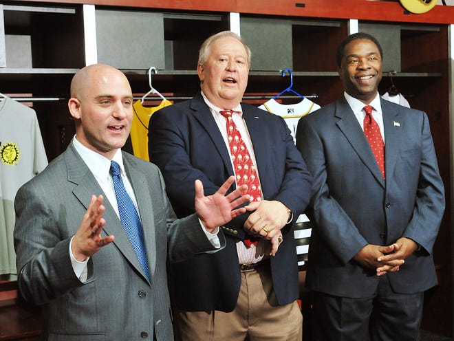 New Suns owner Ken Babby, left, is introduced by current owner Peter Bragan Jr. as Mayor Alvin Brown stands with them in the team's clubhouse Monday.