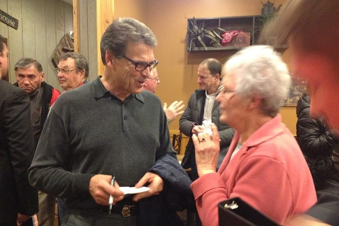 Former Gov. Rick Perry campaigns at a Pizza Ranch in Indianola, Iowa.