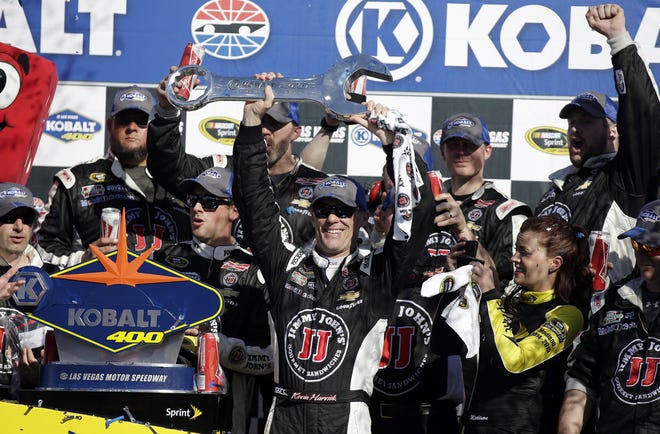 Kevin Harvick celebrates in Victory Lane after winning the Kobalt 400 NASCAR Sprint Cup series auto race Sunday in Las Vegas. AP Photo/Isaac Brekken