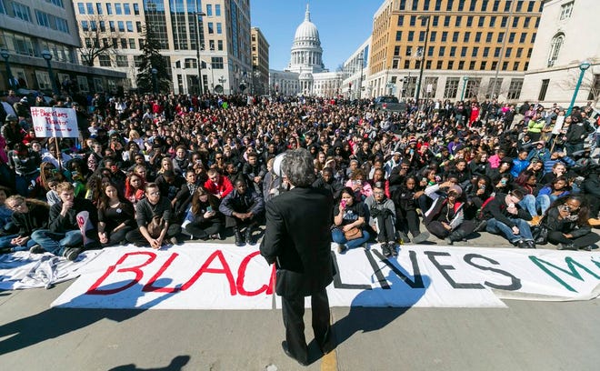 Madison Mayor Paul Soglin addresses a crowd of protestors on Martin Luther King Boulevard Monday, in Madison, Wis., during a protest of the shooting death of Tony Robinson. Robinson, 19, was fatally shot Friday night by a police officer who forced his way into an apartment after hearing a disturbance while responding to a call. Police say Robinson had attacked the officer.