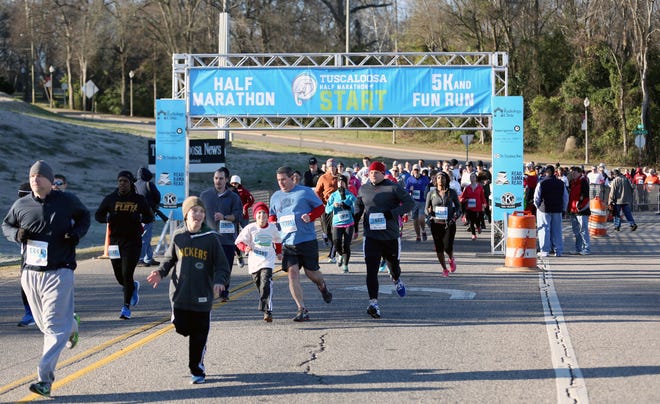 Participants in the third annual Tuscaloosa 5k pass under the start line on Saturday, March 7, 2015 at the Tuscaloosa Amphitheater. The Tuscaloosa News | Kirsten Fiscus
