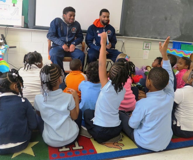 Members of the Virginia State University men's basketball team read to students at Walnut Hill Elementary School on Read Across America Day, March 2. CONTRIBUTED PHOTO