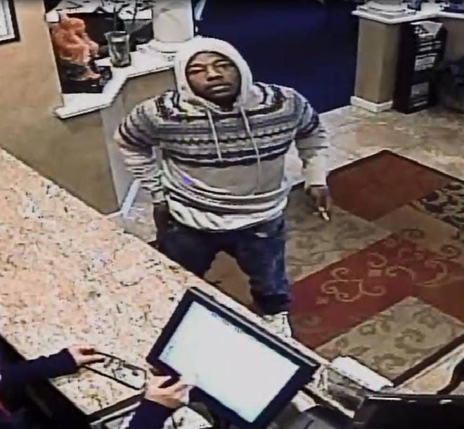 Mount Laurel police released this surveillance image of a man suspected of passing counterfeit $100 bills at two restaurants in the township.