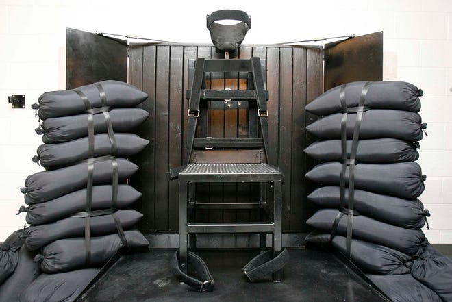 This June 18, 2010, file photo shows the firing squad execution chamber at the Utah State Prison in Draper, Utah. Utah's Gov. Gary Herbert will not say if he'll sign a bill to bring back the firing squad but does say the method would give Utah a backup execution method.