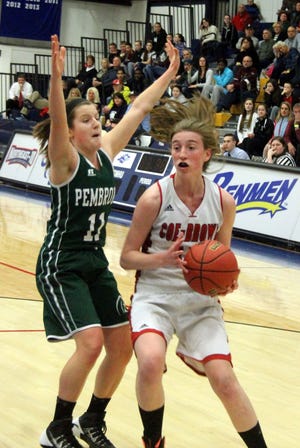 Doyle/Democrat photo 

Coe-Brown's Jenny Schlim, right, looks for an opening while guarded by Pembroke's Molly Hamilton during Division II semifinal action Thursday night in Manchester.