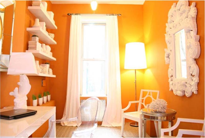 TNS Photo - A cheery orange paint adds a bright burst of color to an otherwise drab office.