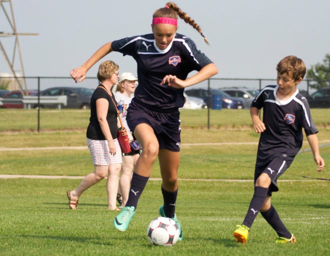 Fiona Fulling, 14, scrimmages with other Raptors youth soccer players on Friday, Aug. 1, 2014, at the kick-off to construction for Reclaiming First, an expansion of Sportscore Two in Loves Park.

RRSTAR.COM FILE PHOTO