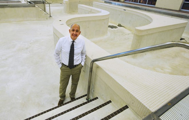 CHIEFTAIN PHOTO/FILE Augie Mendoza, CEO of the YMCA of Pueblo, stands in the empty swimming pool, which was drained due to building damage, on March 26, 2013.