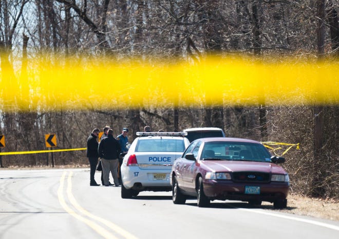 New Jersey State Police investigate the body that was discovered on the bank of the Delaware River along River Road in Burlington Twp, NJ, Thursday, March 12, 2015. Photo by Bryan Woolston / @woolstonphoto.