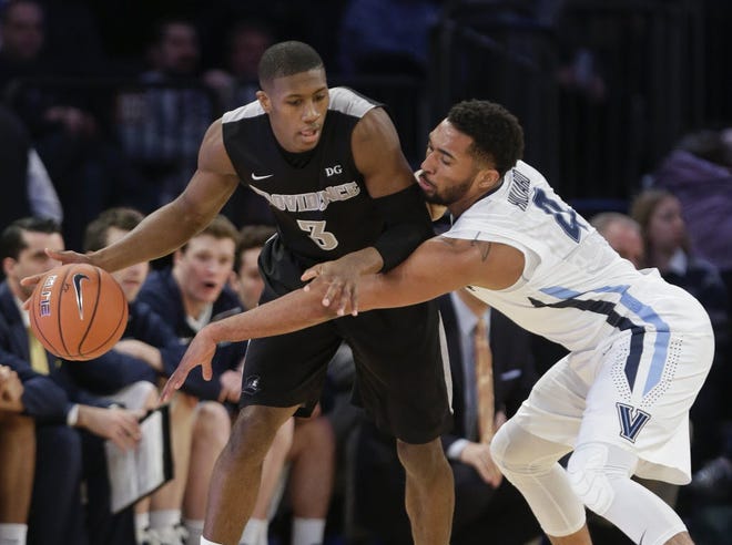 PC point guard Kris Dunn, covered by Villanova's Darrun Hilliard, racked up 22 points, nine assists and seven rebounds on Friday.