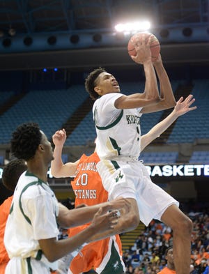 Kinston's Brandon Ingram (13) drives to the rim for two of his game-high 28 points in the fourth quarter of the Vikings' state title win over East Linclon Saturday at Chapel Hill's Dean E. Smith Center.