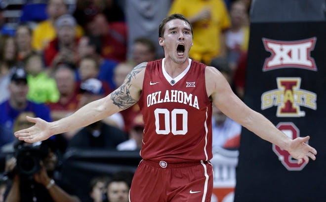 Oklahoma's Ryan Spangler celebrates after making a basket during the first half of an NCAA college basketball game against Iowa State in the semifinals of the Big 12 Conference tournament Friday, March 13, 2015, in Kansas City, Mo. (AP Photo/Charlie Riedel)