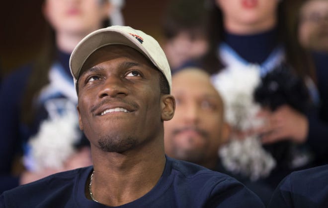 Villanova guard Dylan Ennis watches TV before his team was announced as a No. 1 seed in the Eastern Region of the NCAA basketball tournament Sunday.
