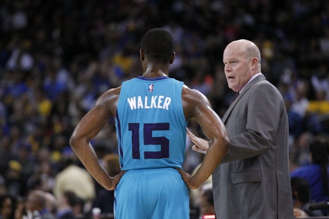 (Associated Press photo) Charlotte Hornets head coach Steve Clifford talks with Kemba Walker (15) during a game earlier this season. The Hornets enter this week at 29-35 and only a half-game out of 7th in the Eastern Conference but only three games ahead of 11th place.