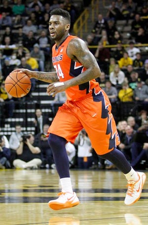 Illinois guard Rayvonte Rice (24) brings the ball down the court during the second half of an NCAA college basketball game against Iowa, Wednesday, Feb. 25, 2015, in Iowa City, Iowa.