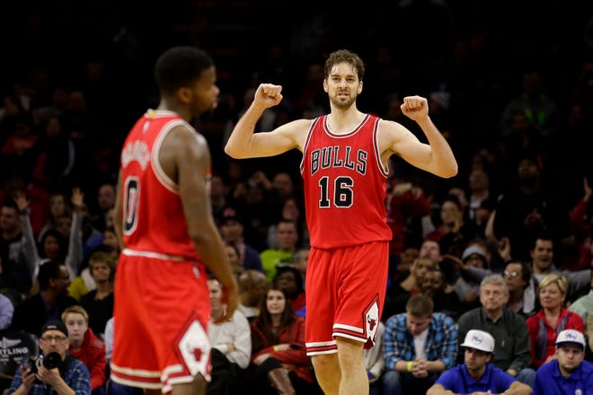 Chicago Bulls' Pau Gasol (16), of Spain, reacts after Aaron Brooks (0) made a three-pointer during overtime of an NBA basketball game against the Philadelphia 76ers, Wednesday, March 11, 2015, in Philadelphia. Chicago won 104-95 in overtime. (AP Photo/Matt Slocum)
