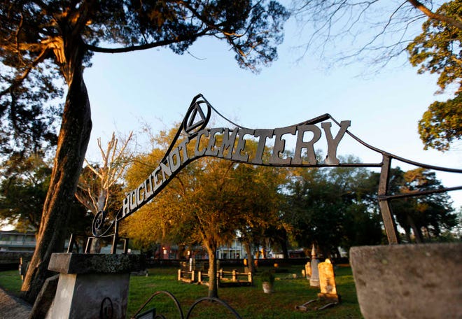 DARON.DEAN@STAUGUSTINE.COM The rising sun begins to cast its glow on the Huguenot Cemetery, at the corner of S. Castillo Drive and Orange Street, Sunday morning, March 15, 2015.