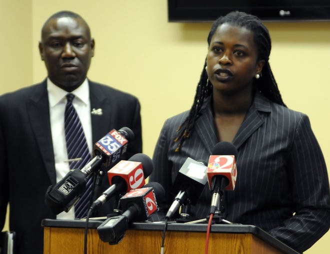 Krystal Brown is shown with her attorney Benjamin Crump during a press conference relating to the death of her ex-husband Marlon Brown.