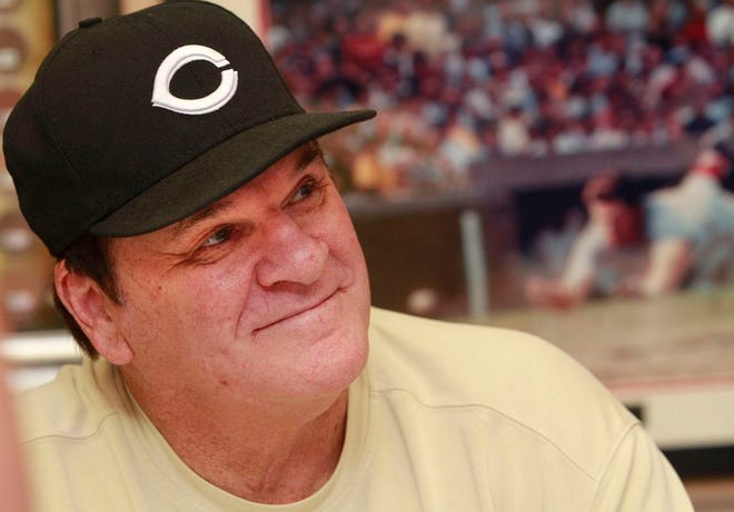 In this July 26, 2011, file photo, former Cincinnati Reds player Pete Rose signs autographs at the Collectors Den in at a mall in Indianapolis. Rose has submitted a new request to be reinstated to baseball, according to new Commissioner Rob Manfred. After meeting with the Los Angeles Dodgers on Monday, March 16, 2015, Manfred said "I do have a formal request from Pete. (AP Photo/The Indianapolis Star, Charlie Nye, File)