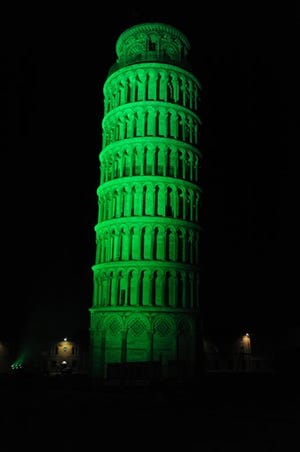 This image supplied by Tourism Ireland on Monday March 16, 2015 shows the Leaning Tower of Pisa in Italy, floodlit green to celebrate St Patrick's Day on Tuesday. Landmark buildings across Ireland and the world have been floodlit green as global celebrations of the Emerald Isle's patron saint are culminating in parades and celebrations in Dublin and other cities, particularly in the U.S., on St. Patrick's Day. (AP Photo/Sarto Roberto, Tourism Ireland)