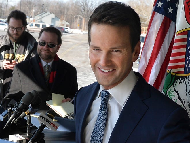 U.S. Rep. Aaron Schock, R-Ill., leaves after a news conference regarding his recent spending controversies outside his office in Peoria, Ill. on Friday, March 6, 2015.
