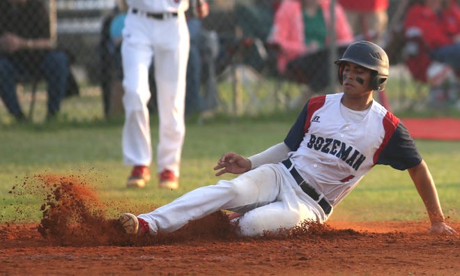 Bozeman's Nicky Agosto slides into home during the Bucks' 7-2 win over Liberty County on Tuesday.