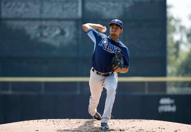 Tampa Bay Rays starting pitcher Chris Archer (22) delivers a warmup pitch before the start of in an exhibition baseball game against the Toronto Blue Jays in Dunedin, Fla., Wednesday, March 18, 2015. (AP Photo/Kathy Willens)