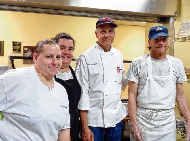 Saturday’s Cafe Hope graduates Melissa Witzgall, Lori Creamer and Michael Hoffman are shown with retired executive chef Travis Herr in the kitchen at FUMC’s Trinity Center.
