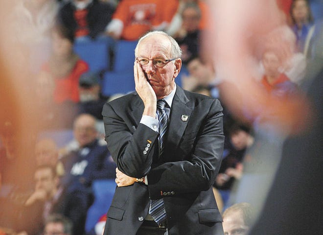 Bill Wippert/Associated Press Syracuse head coach Jim Boeheim watches his team play during the second half of a second-round game in last season's NCAA tournament in Buffalo, N.Y.