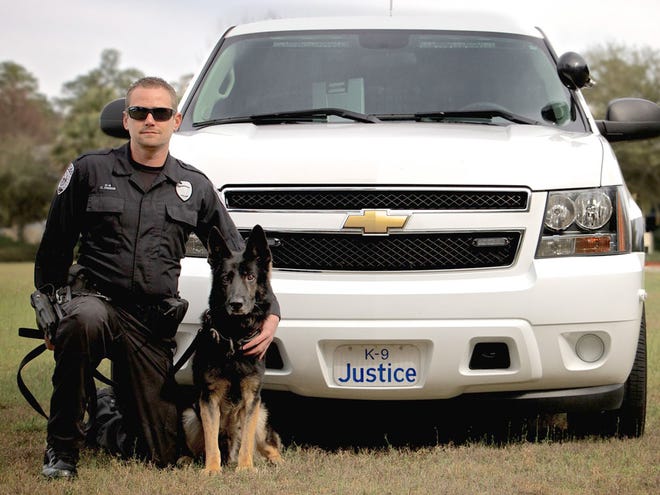 K-9 Justice - shown with his handler, Gainesville Police Department Officer C. Owens - has retired from the force.