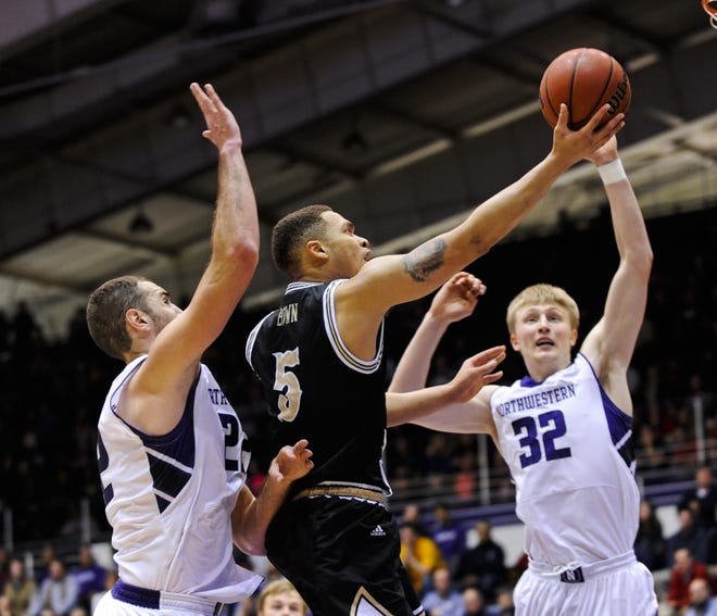 Western Michigan guard David Brown (5) shoots past Northwestern center Alex Olah (22) and Wildcats forward Nathan Taphorn (32) during the second half of their Dec. 20 game.

THE ASSOCIATED PRESS
