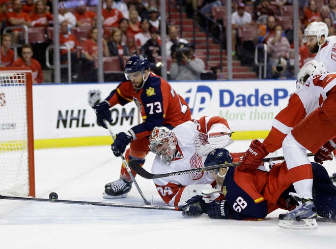 Detroit Red Wings goalie Petr Mrazek 934) and Florida Panthers right wing Jaromir Jagr (68) watch as Florida Panthers center Brandon Pirri (73) prepares to shoot the puck for a score during the second period of an NHL hockey game, Thursday, March 19, 2015, in Sunrise, Fla. (AP Photo/Lynne Sladky)