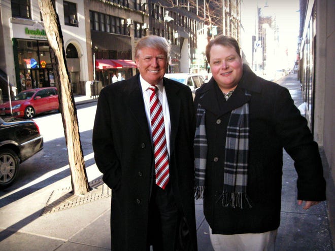 Donald Trump and Wade Allen pose for a picture on Feb. 16 near Rockefeller Center in New York City. Trump stopped by NBC studios to promote ‘The Celebrity Apprentice’ and signed Allen’s autograph book.