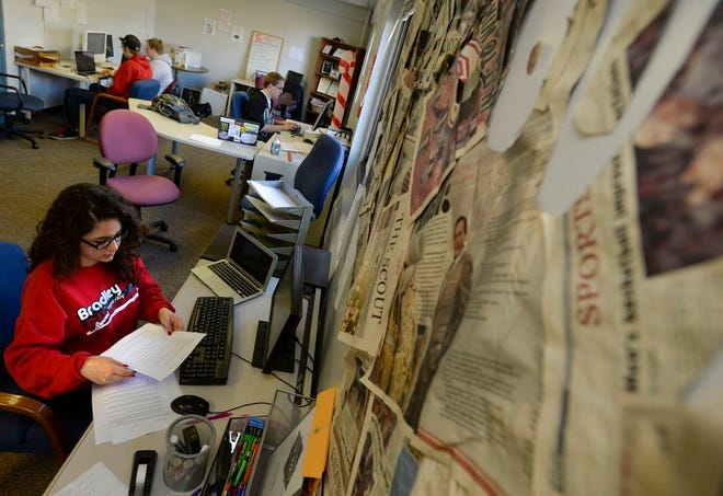 In this Journal Star file photo from 2014, Bradley University student Tori Moses, a copy editor at The Scout, works on an upcoming edition at the student newspaper's office.