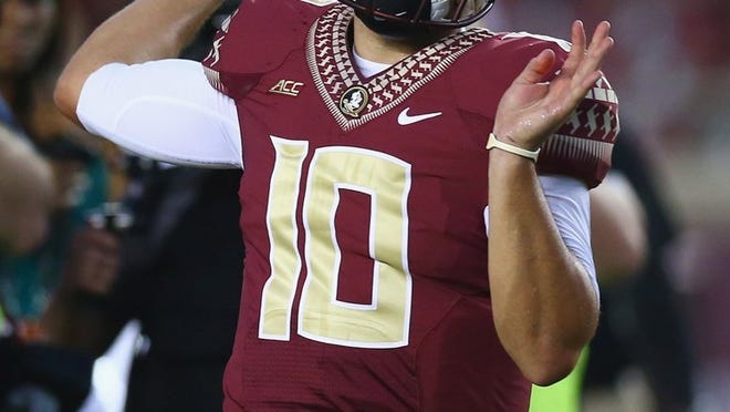 Florida State quarterback Sean Maguire, warming up before his start on Sept. 20 against Clemson, impressed many in leading the Seminoles to the victory and is the favorite to start this season. (Photo by Ronald Martinez/Getty Images)