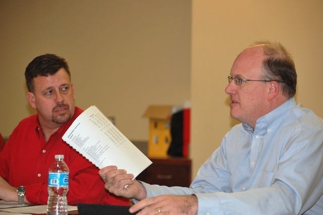 Stacy Ryburn • Times Record / At-Large Director Kevin Settle, right, discusses budget policy Thursday, March 19, 2015, while Ward 3 Director Mike Lorenz listens at the River Park Events Building.