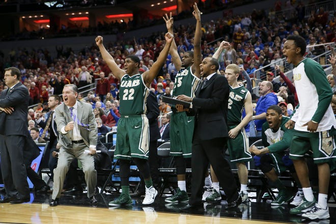 The UAB bench cheers after guard Robert Brown hit a 3-point basket in the closing seconds against Iowa State on Thursday. UAB won the game, 60-59, and will play UCLA today at 11:10 a.m.
