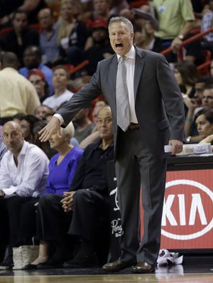Sixers head coach Brett Brown shouts instructions to the players during a Feb. 23 game in Miami.