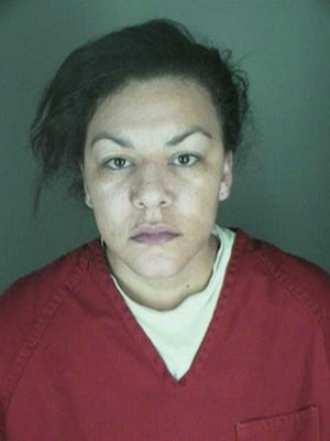 CORRECTS SPELLING OF LAST NAME TO LANE INSTEAD OF LYNE - This undated booking photo provided by the Longmont Police Department shows Dynel Lane, 34, who is accused of stabbing a pregnant woman in the stomach and removing her baby, while the expectant mother visited her home to buy baby clothes advertised on Craigslist authorities said. The 26-year-old expectant mother was found beaten and stabbed at the suspect's home, has undergone surgery, and on Thursday was alert, police said. The baby did not survive. (AP Photo/ Longmont Police Department)