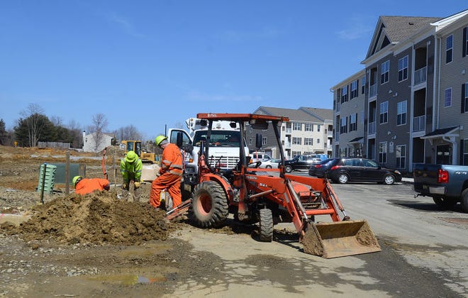 Utility workers investigate a gas leak at the Village at Parkers Mill in Mount Holly on Monday, March 25, 2015.