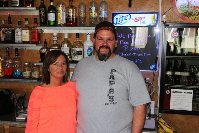 Mark Crain, owner of Papa's Bar and Grill, stands with Dawn Mason behind the bar at Papa's. Crain was enlisted by Chris Perdue of Monmouth to help revive the canceled Easter Egg Hunt, held annually at Monmouth Park. Papa's and B Parlour — formerly Salon Panache — are currently accepting donations for the hunt, which will be held at 11 a.m. April 4.