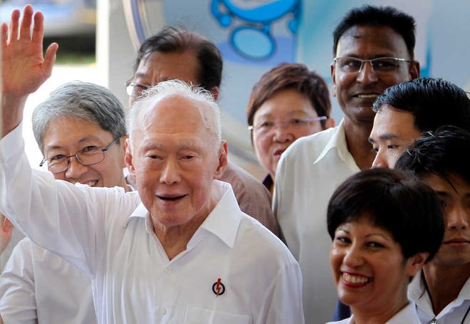 FILE - In this April 27, 2011, file photo, Singapore's then Minister Mentor Lee Kuan Yew waves to supporters as he arrives at an elections nomination center in Singapore. Lee Kuan Yew, the founder of modern Singapore who helped transform the sleepy port into one of the world's richest nations, died Monday, March 23, 2015, the government said. He was 91. (AP Photo/Wong Maye-E, File)
