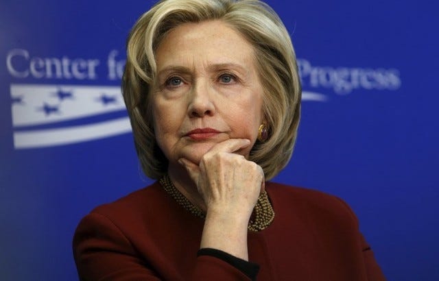 Former U.S. Secretary of State Hillary Clinton listens to remarks as she takes part in a Center for American Progress roundtable discussion on "Expanding Opportunities in America's Urban Areas" in Washington March 23, 2015. REUTERS/Kevin Lamarque