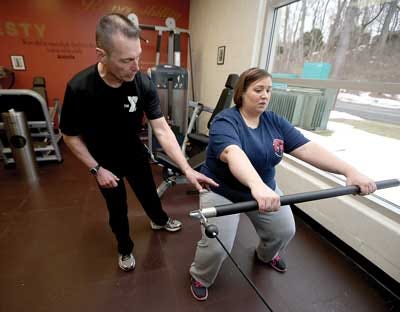 Photos by Daniel Freel/New Jersey Herald Melissa Olsen, of Vernon, gets some instruction from Sussex County YMCA personal trainer Kevin Carhart.