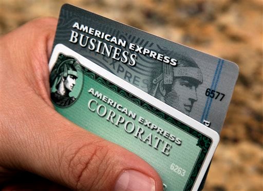 FILE - In this Jan. 20, 2010 file photo, American Express cards are posed for a photograph in Phoenix. Amex’s stock is down 11 percent this year, making it the second-biggest decliner on the Dow Jones industrial average. (AP Photo/Ross D. Franklin, File)